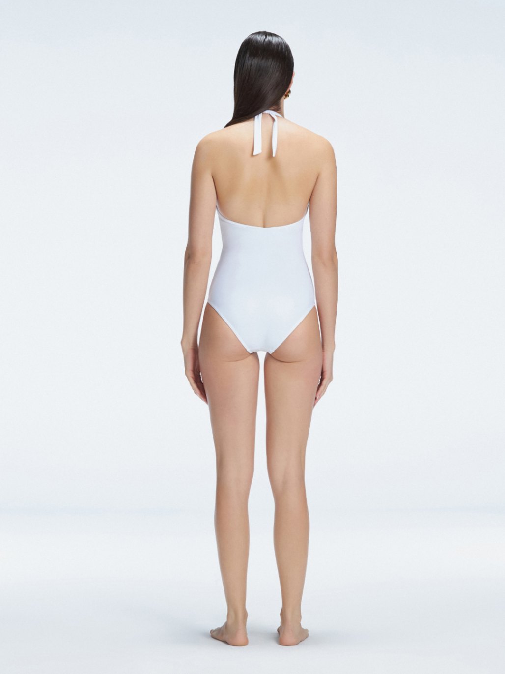 Miley White Halter Swimsuit | Moeva | One-Piece | Each week unveils new pieces—luxury swimwear, fluid resort silhouettes, and elevated summer-to-evening essentials designed to carry you from coastal escapes to city nights.