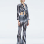 Greta Long Sleeve Tie Front Shirt and Freya High Waist Pants Black Optical Set | Moeva | Set | Each week unveils new pieces—luxury swimwear, fluid resort silhouettes, and elevated summer-to-evening essentials designed to carry you from coastal escapes to city nights.