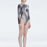 Mireya Black Optical Long Sleeve Bodysuit | Moeva | One-Piece | Each week unveils new pieces—luxury swimwear, fluid resort silhouettes, and elevated summer-to-evening essentials designed to carry you from coastal escapes to city nights.