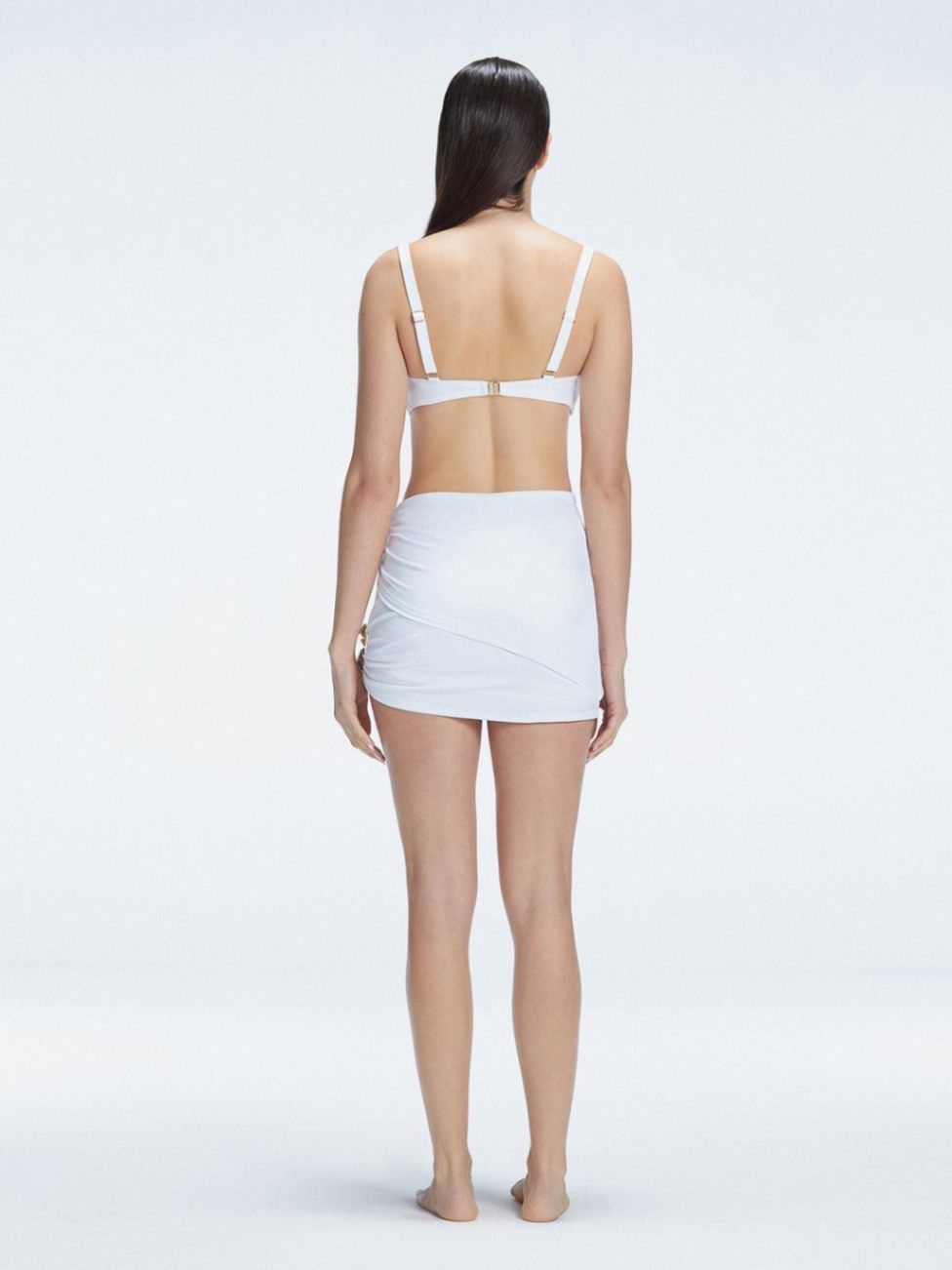 Siena White Mesh Detail Mini Skirt | Moeva | Beachwear Skirts | Each week unveils new pieces—luxury swimwear, fluid resort silhouettes, and elevated summer-to-evening essentials designed to carry you from coastal escapes to city nights.