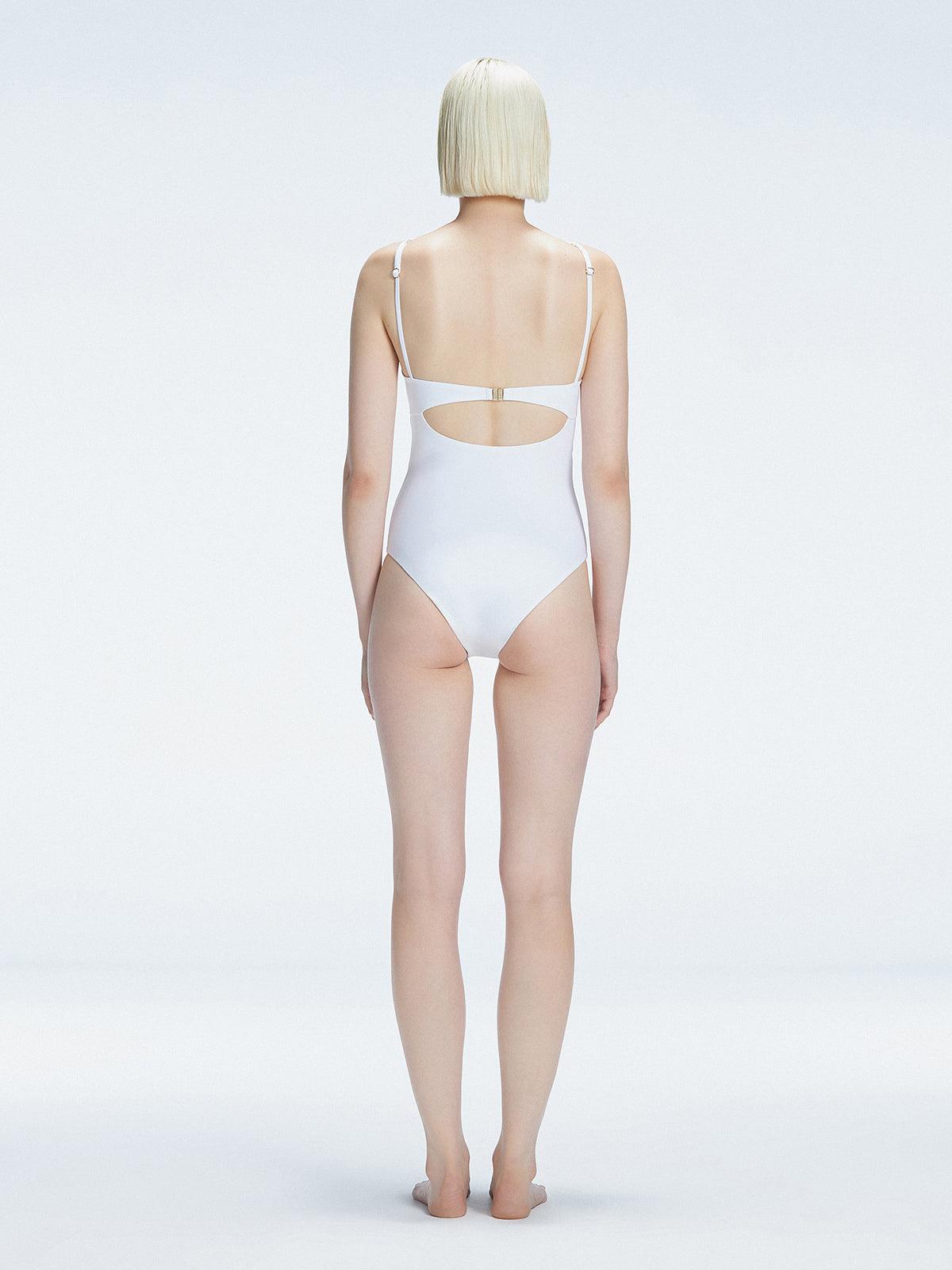 5eleven Mag Editorial - Lyra White Halter Swimsuit | Moeva | One-Piece | Each week unveils new pieces—luxury swimwear, fluid resort silhouettes, and elevated summer-to-evening essentials designed to carry you from coastal escapes to city nights.