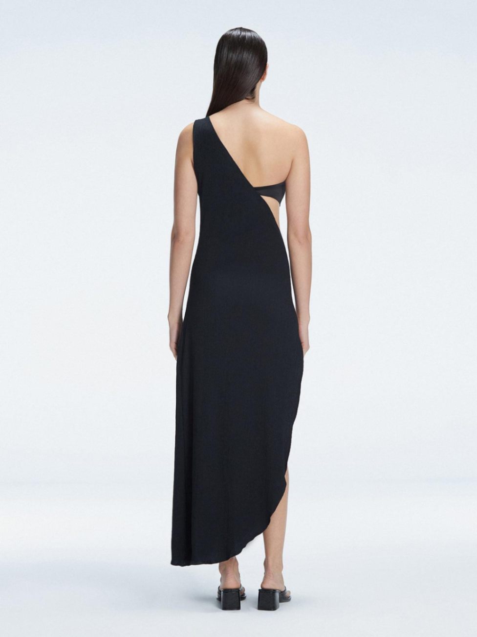 Coraline Black One Shoulder Asymetrical Maxi Dress | Moeva | Beachwear Dresses | Each week unveils new pieces—luxury swimwear, fluid resort silhouettes, and elevated summer-to-evening essentials designed to carry you from coastal escapes to city nights.