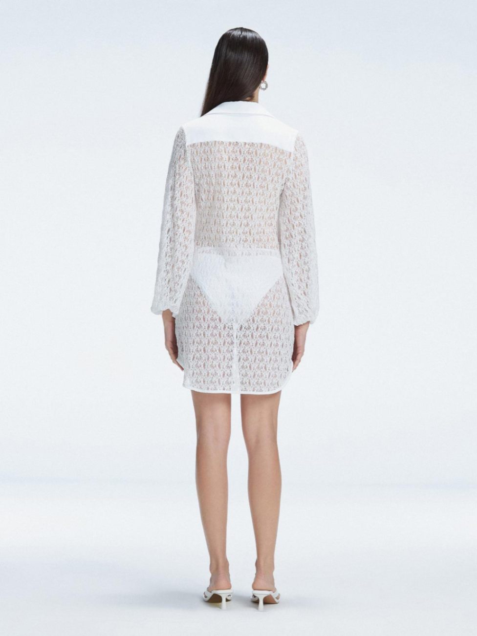 Althea White Long Sleeve Lace Mini Kaftan | Moeva | Beachwear Dresses | Each week unveils new pieces—luxury swimwear, fluid resort silhouettes, and elevated summer-to-evening essentials designed to carry you from coastal escapes to city nights.