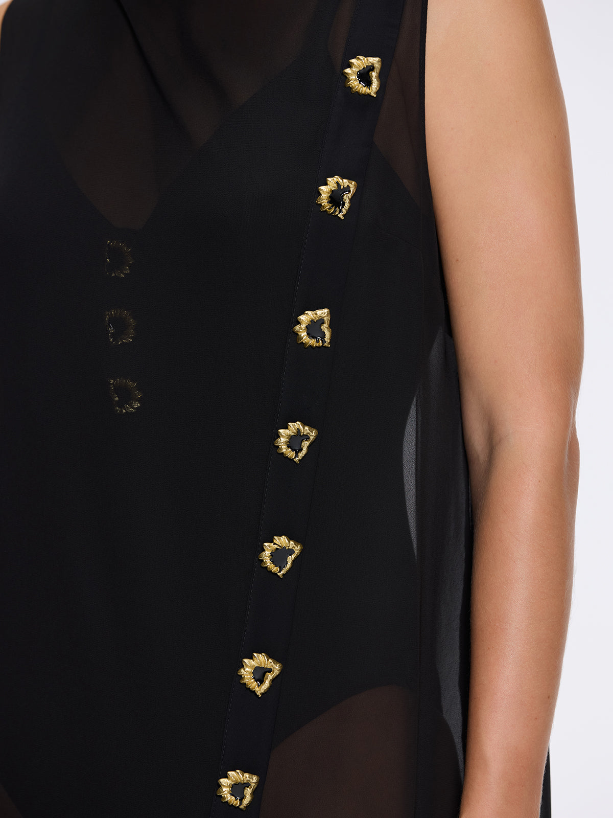 Solianne Black Sheer Sleeveless Asymmetric Dress with Gold Button Detail | Moeva | Dress | Each week unveils new pieces—luxury swimwear, fluid resort silhouettes, and elevated summer-to-evening essentials designed to carry you from coastal escapes to city nights.