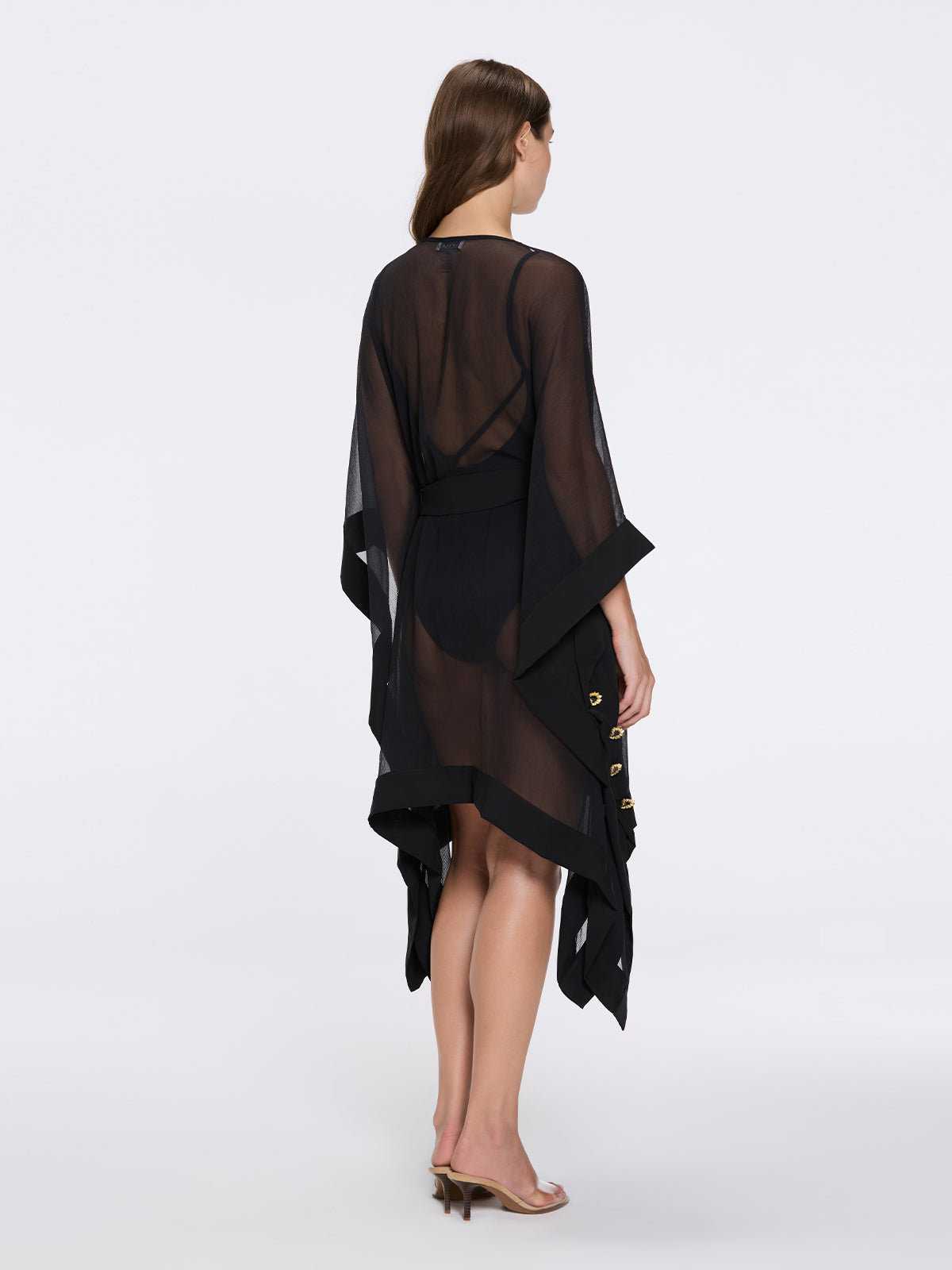Bianca Ella Booth-Tata Black Sheer Gold Buttoned Belted Kaftan with Asymmetric Hem | Moeva | Kaftan | Each week unveils new pieces—luxury swimwear, fluid resort silhouettes, and elevated summer-to-evening essentials designed to carry you from coastal escapes to city nights.