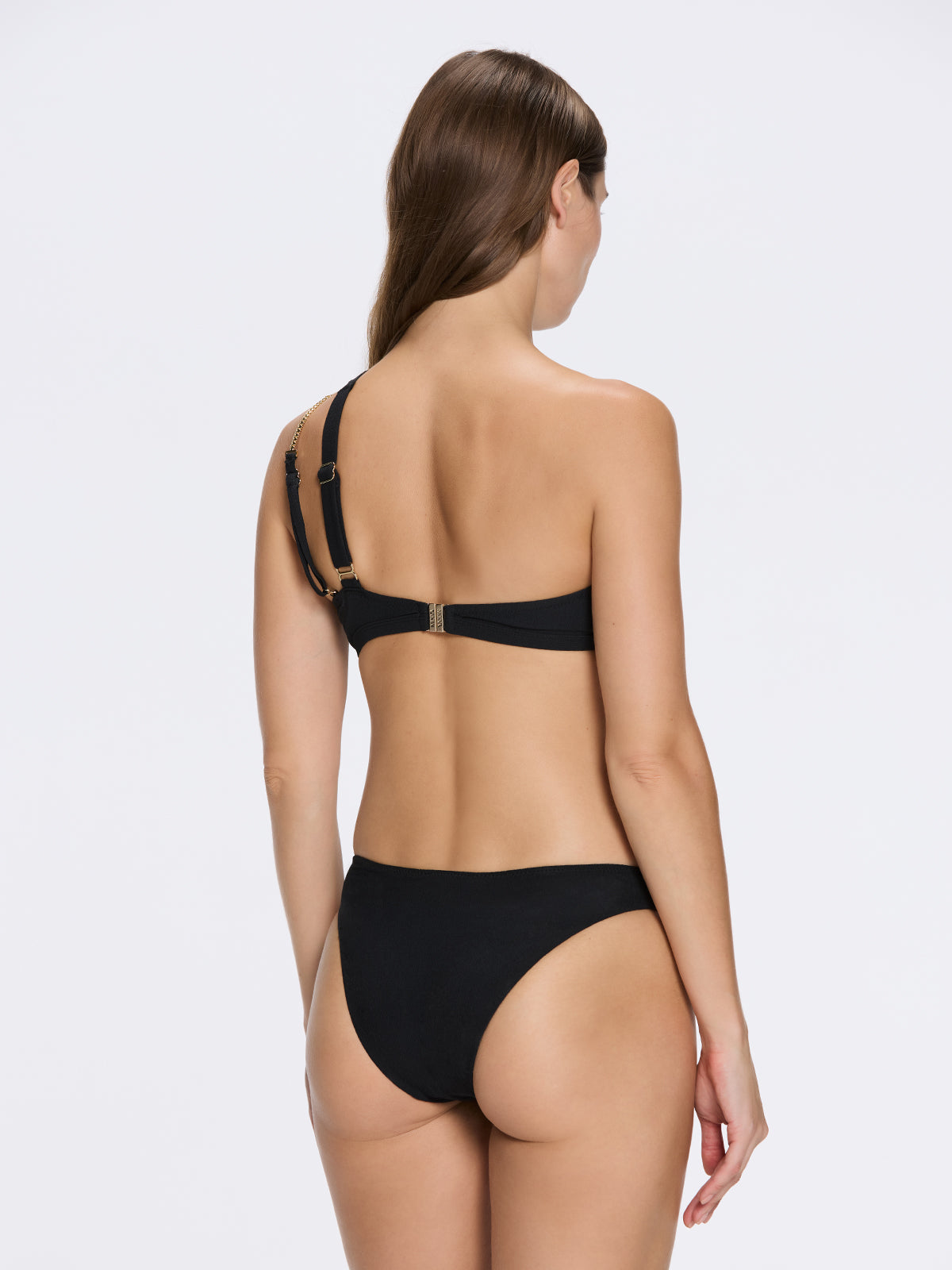 Grasse Gold Chain One-Shoulder Mid Coverage Textured Black Bikini Set | Moeva | Bikini Set | Each week unveils new pieces—luxury swimwear, fluid resort silhouettes, and elevated summer-to-evening essentials designed to carry you from coastal escapes to city nights.