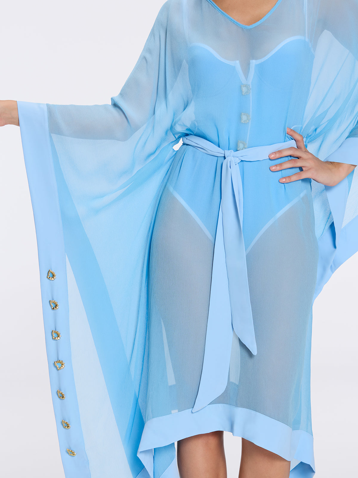 Tata Blue Sheer Gold Buttoned Belted Kaftan with Asymmetric Hem | Moeva | Kaftan | Each week unveils new pieces—luxury swimwear, fluid resort silhouettes, and elevated summer-to-evening essentials designed to carry you from coastal escapes to city nights.