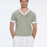 Troy Green/White V-Neck T-Shirt with Contrast Trim | Moeva | | Each week unveils new pieces—luxury swimwear, fluid resort silhouettes, and elevated summer-to-evening essentials designed to carry you from coastal escapes to city nights.