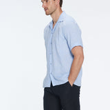 Romeo Baby Blue Linen Shirt with Camp Collar | Moeva | Men Classic Collar Shirts | Each week unveils new pieces—luxury swimwear, fluid resort silhouettes, and elevated summer-to-evening essentials designed to carry you from coastal escapes to city nights.