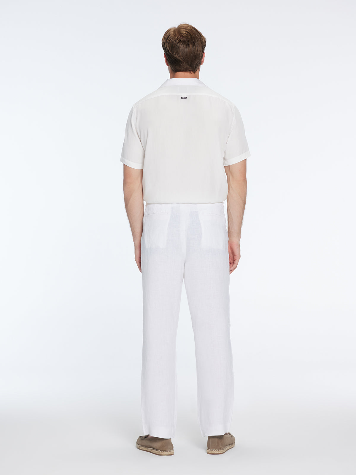 Adrian White Linen Straight-Leg Pants | Moeva | Pants | Each week unveils new pieces—luxury swimwear, fluid resort silhouettes, and elevated summer-to-evening essentials designed to carry you from coastal escapes to city nights.