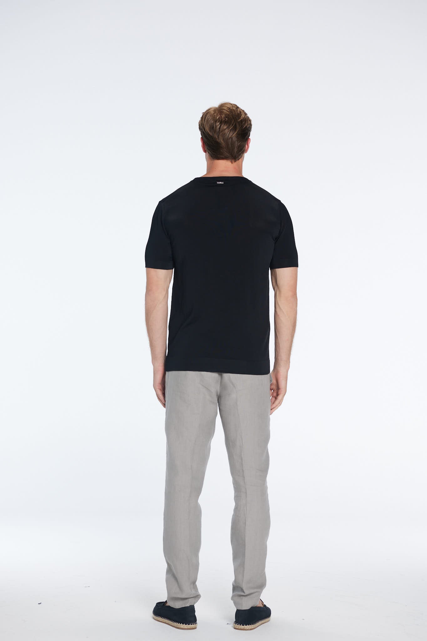 Oscar Black Round Neck T-Shirt | Moeva | Men Round Neck Shirts | Each week unveils new pieces—luxury swimwear, fluid resort silhouettes, and elevated summer-to-evening essentials designed to carry you from coastal escapes to city nights.