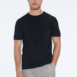 Atlas Black Cotton Round Neck T-Shirt | Moeva | Men Round Neck Shirts | Each week unveils new pieces—luxury swimwear, fluid resort silhouettes, and elevated summer-to-evening essentials designed to carry you from coastal escapes to city nights.
