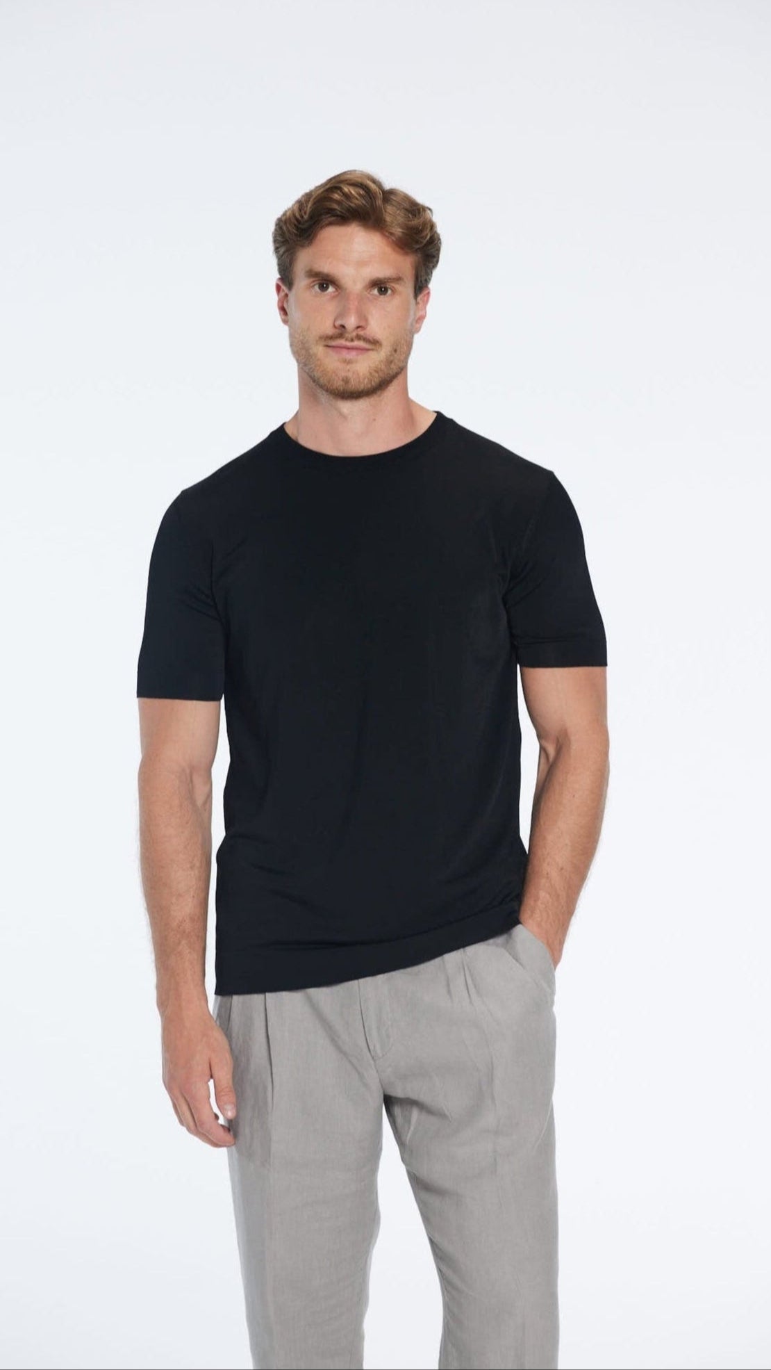Atlas Black Cotton Round Neck T-Shirt | Moeva | Men Round Neck Shirts | Each week unveils new pieces—luxury swimwear, fluid resort silhouettes, and elevated summer-to-evening essentials designed to carry you from coastal escapes to city nights.