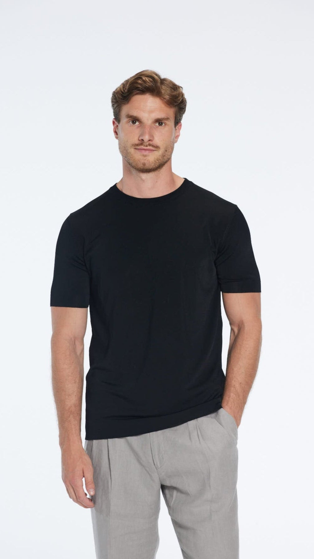 Oscar Black Round Neck T-Shirt | Moeva | T-Shirt | Each week unveils new pieces—luxury swimwear, fluid resort silhouettes, and elevated summer-to-evening essentials designed to carry you from coastal escapes to city nights.