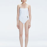"Model wearing the Marigold White Swimsuit from the Synersphere SS25 collection, with a square neckline and boned torso."