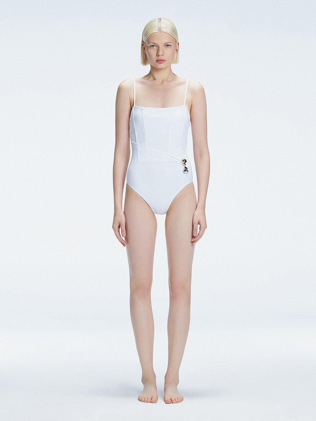 "Model wearing the Marigold White Swimsuit from the Synersphere SS25 collection, with a square neckline and boned torso."