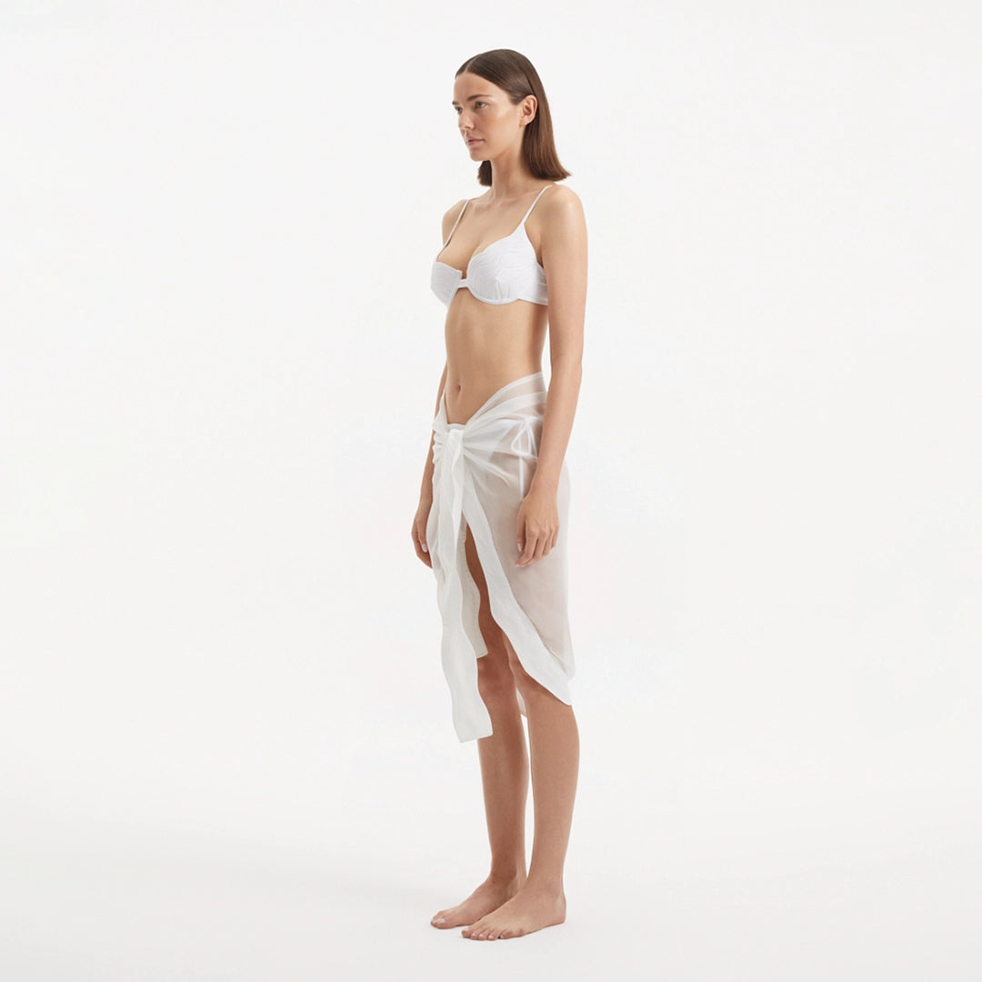 Raiden White Tie Front Wavy-Trim Sheer Sarong | Moeva | Sarong | Each week unveils new pieces—luxury swimwear, fluid resort silhouettes, and elevated summer-to-evening essentials designed to carry you from coastal escapes to city nights.