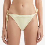 Salila Yellow Side Tie Wave Textured Bikini Bottom | Moeva | Bikini Bottom | Each week unveils new pieces—luxury swimwear, fluid resort silhouettes, and elevated summer-to-evening essentials designed to carry you from coastal escapes to city nights.