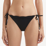 Salila Black Side Tie Wave Textured Bikini Bottom | Moeva | Bikini Bottom | Each week unveils new pieces—luxury swimwear, fluid resort silhouettes, and elevated summer-to-evening essentials designed to carry you from coastal escapes to city nights.