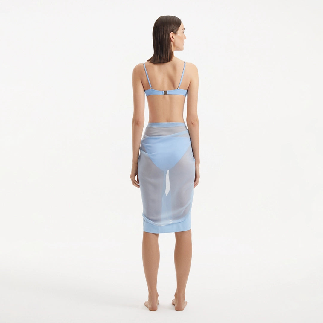 Raiden Baby Blue Tie Front Wavy-Trim Sheer Sarong | Moeva | Sarong | Each week unveils new pieces—luxury swimwear, fluid resort silhouettes, and elevated summer-to-evening essentials designed to carry you from coastal escapes to city nights.