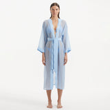 Blaze Long Sleeve Wavy-Trim Belted Sheer Baby Blue Kaftan | Moeva | Kaftan | Each week unveils new pieces—luxury swimwear, fluid resort silhouettes, and elevated summer-to-evening essentials designed to carry you from coastal escapes to city nights.