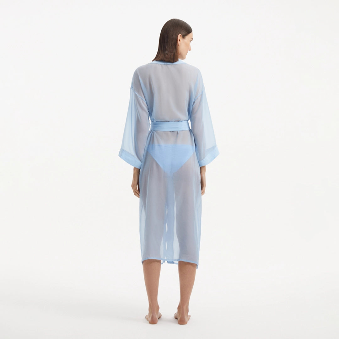 Blaze Long Sleeve Wavy-Trim Belted Sheer Baby Blue Kaftan | Moeva | Kaftan | Each week unveils new pieces—luxury swimwear, fluid resort silhouettes, and elevated summer-to-evening essentials designed to carry you from coastal escapes to city nights.