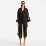 Blaze Long Sleeve Wavy-Trim Belted Sheer Black Kaftan | Moeva | Kaftan | Each week unveils new pieces—luxury swimwear, fluid resort silhouettes, and elevated summer-to-evening essentials designed to carry you from coastal escapes to city nights.