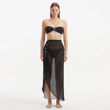 Xander Black Sheer Maxi Skirt with Gold Button Details | Moeva | Skirt | Each week unveils new pieces—luxury swimwear, fluid resort silhouettes, and elevated summer-to-evening essentials designed to carry you from coastal escapes to city nights.