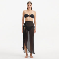 Xander Black Sheer Maxi Skirt with Gold Button Details | Moeva | Skirt | Each week unveils new pieces—luxury swimwear, fluid resort silhouettes, and elevated summer-to-evening essentials designed to carry you from coastal escapes to city nights.