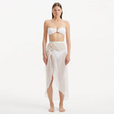 Xander White Sheer Maxi Skirt with Gold Button Details | Moeva | Skirt | Each week unveils new pieces—luxury swimwear, fluid resort silhouettes, and elevated summer-to-evening essentials designed to carry you from coastal escapes to city nights.