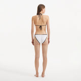 Zarya White Triangle Textured Mid Coverage Bikini Set | Moeva | | Each week unveils new pieces—luxury swimwear, fluid resort silhouettes, and elevated summer-to-evening essentials designed to carry you from coastal escapes to city nights.