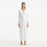 Nira White Dress | Moeva | RTW Dresses | Each week unveils new pieces—luxury swimwear, fluid resort silhouettes, and elevated summer-to-evening essentials designed to carry you from coastal escapes to city nights.