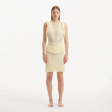 Diani Yellow Fringe Detail Sheer Panel Open Back Mini Dress | Moeva | Dress | Each week unveils new pieces—luxury swimwear, fluid resort silhouettes, and elevated summer-to-evening essentials designed to carry you from coastal escapes to city nights.