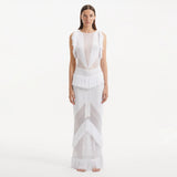 Maris White Knitted Maxi Dress with Fringe and Open Back | Moeva | Dress | Each week unveils new pieces—luxury swimwear, fluid resort silhouettes, and elevated summer-to-evening essentials designed to carry you from coastal escapes to city nights.