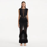 Maris Black Knitted Maxi Dress with Fringe and Open Back | Moeva | Dress | Each week unveils new pieces—luxury swimwear, fluid resort silhouettes, and elevated summer-to-evening essentials designed to carry you from coastal escapes to city nights.