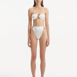 Clyde White Bandeau Satin Bikini Top | Moeva | Bikini Top | Each week unveils new pieces—luxury swimwear, fluid resort silhouettes, and elevated summer-to-evening essentials designed to carry you from coastal escapes to city nights.
