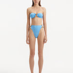 Clyde Baby Blue Bandeau Satin Bikini Top | Moeva | Bikini Top | Each week unveils new pieces—luxury swimwear, fluid resort silhouettes, and elevated summer-to-evening essentials designed to carry you from coastal escapes to city nights.
