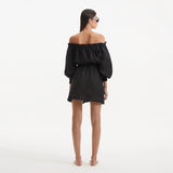 Sumner Black Off-Shoulder Linen Mini Dress | Moeva | Dress | Each week unveils new pieces—luxury swimwear, fluid resort silhouettes, and elevated summer-to-evening essentials designed to carry you from coastal escapes to city nights.