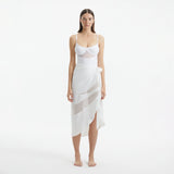 Pelagia White Tie Front Wavy-Trim Sheer Sarong | Moeva | Sarong | Each week unveils new pieces—luxury swimwear, fluid resort silhouettes, and elevated summer-to-evening essentials designed to carry you from coastal escapes to city nights.