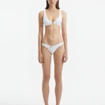 Aeron White V Neck Textured Bikini Top | Moeva | Bikini Top | Each week unveils new pieces—luxury swimwear, fluid resort silhouettes, and elevated summer-to-evening essentials designed to carry you from coastal escapes to city nights.