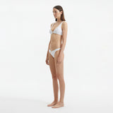 Aeron White V Neck Textured Mid Coverage Bikini Set | Moeva | | Each week unveils new pieces—luxury swimwear, fluid resort silhouettes, and elevated summer-to-evening essentials designed to carry you from coastal escapes to city nights.