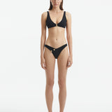 Aeron Black V Neck Textured Bikini Top | Moeva | Bikini Top | Each week unveils new pieces—luxury swimwear, fluid resort silhouettes, and elevated summer-to-evening essentials designed to carry you from coastal escapes to city nights.