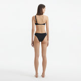 Eyre Black One Shoulder Mid Coverage Textured Bikini Set | Moeva | Bikini Set | Each week unveils new pieces—luxury swimwear, fluid resort silhouettes, and elevated summer-to-evening essentials designed to carry you from coastal escapes to city nights.