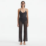 Luz Silver Metallic Sheer Knit Pants | Moeva | Pants | Each week unveils new pieces—luxury swimwear, fluid resort silhouettes, and elevated summer-to-evening essentials designed to carry you from coastal escapes to city nights.