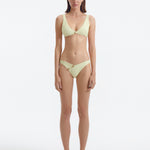 Aeron Yellow V Neck Textured Bikini Top | Moeva | Bikini Top | Each week unveils new pieces—luxury swimwear, fluid resort silhouettes, and elevated summer-to-evening essentials designed to carry you from coastal escapes to city nights.