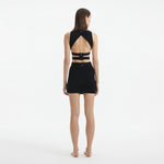 Jazero Black Knitted Cut-Out Skirt | Moeva | Skirt | Each week unveils new pieces—luxury swimwear, fluid resort silhouettes, and elevated summer-to-evening essentials designed to carry you from coastal escapes to city nights.