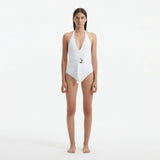 Imelda White Halterneck Swimsuit with Gold Detail | Moeva | Swimsuit | Each week unveils new pieces—luxury swimwear, fluid resort silhouettes, and elevated summer-to-evening essentials designed to carry you from coastal escapes to city nights.