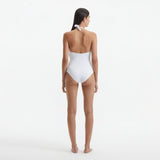 Imelda White Halterneck Swimsuit with Gold Detail | Moeva | Swimsuit | Each week unveils new pieces—luxury swimwear, fluid resort silhouettes, and elevated summer-to-evening essentials designed to carry you from coastal escapes to city nights.