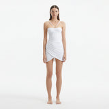 Osaka White Corset Mini Dress with Wrap Skirt | Moeva | RTW Dresses | Each week unveils new pieces—luxury swimwear, fluid resort silhouettes, and elevated summer-to-evening essentials designed to carry you from coastal escapes to city nights.