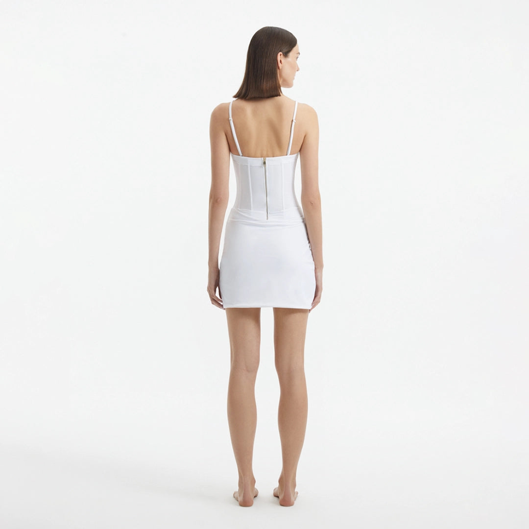 Osaka White Corset Mini Dress with Wrap Skirt | Moeva | RTW Dresses | Each week unveils new pieces—luxury swimwear, fluid resort silhouettes, and elevated summer-to-evening essentials designed to carry you from coastal escapes to city nights.